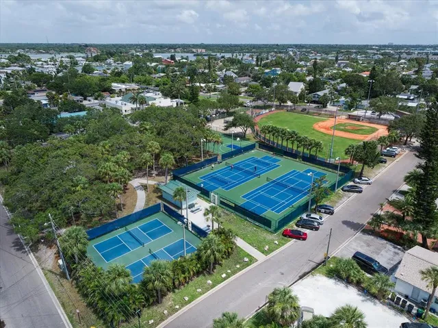 an aerial view of a house with a garden and swimming pool