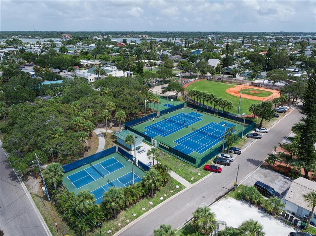 829 East Gulf Boulevard, Unit 107 Indian Rocks Beach, FL 33785 - Photo 32 of 43 an aerial view of a house with a garden and swimming pool