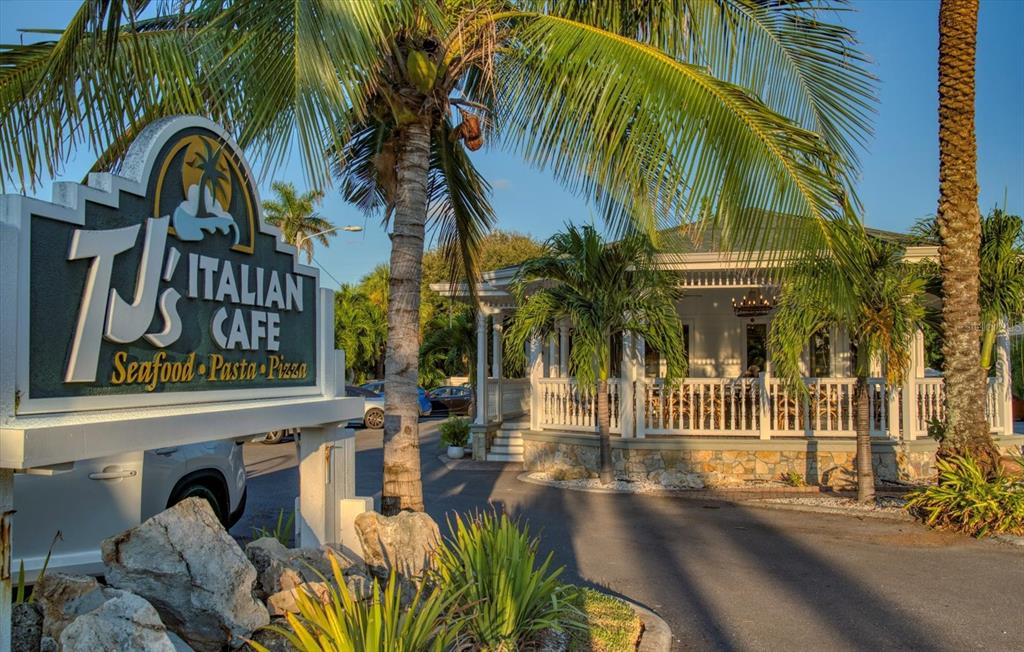 829 East Gulf Boulevard, Unit 107 Indian Rocks Beach, FL 33785 - Photo 35 of 43 a front view of a house with garden