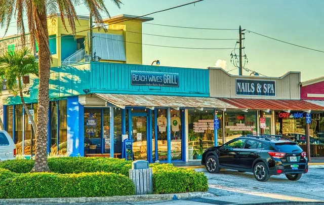 a view of a building with a garden and plants