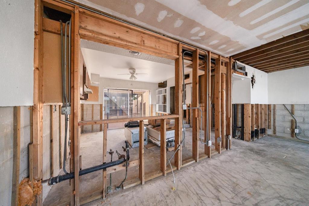 829 East Gulf Boulevard, Unit 107 Indian Rocks Beach, FL 33785 - Photo 10 of 43 a view of a hallway with wooden floor and staircase