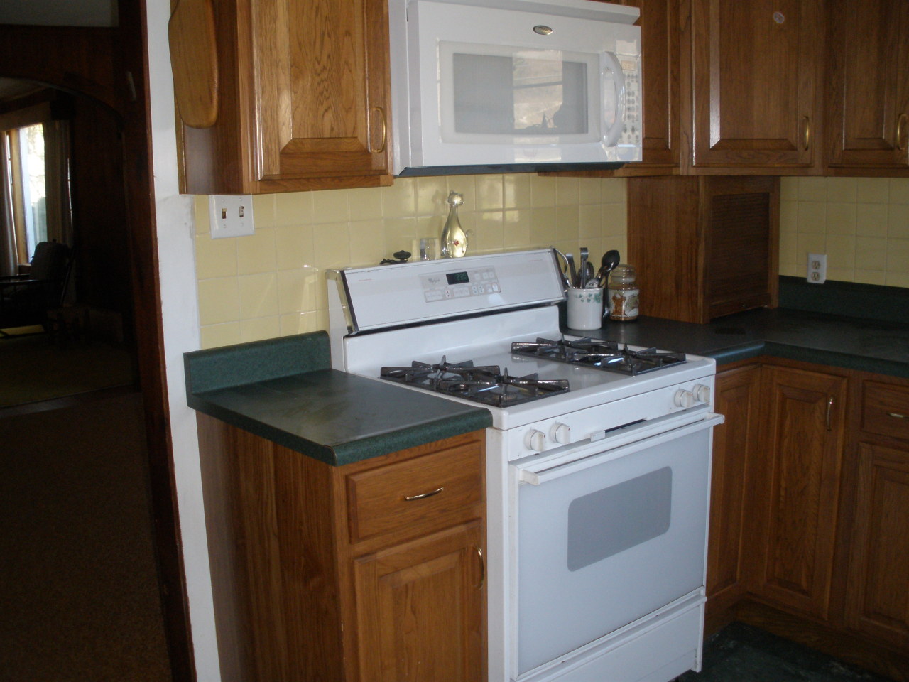 1603 North Main Road Otis, MA 01253 - Photo 12 of 17 a kitchen with a stove and a microwave