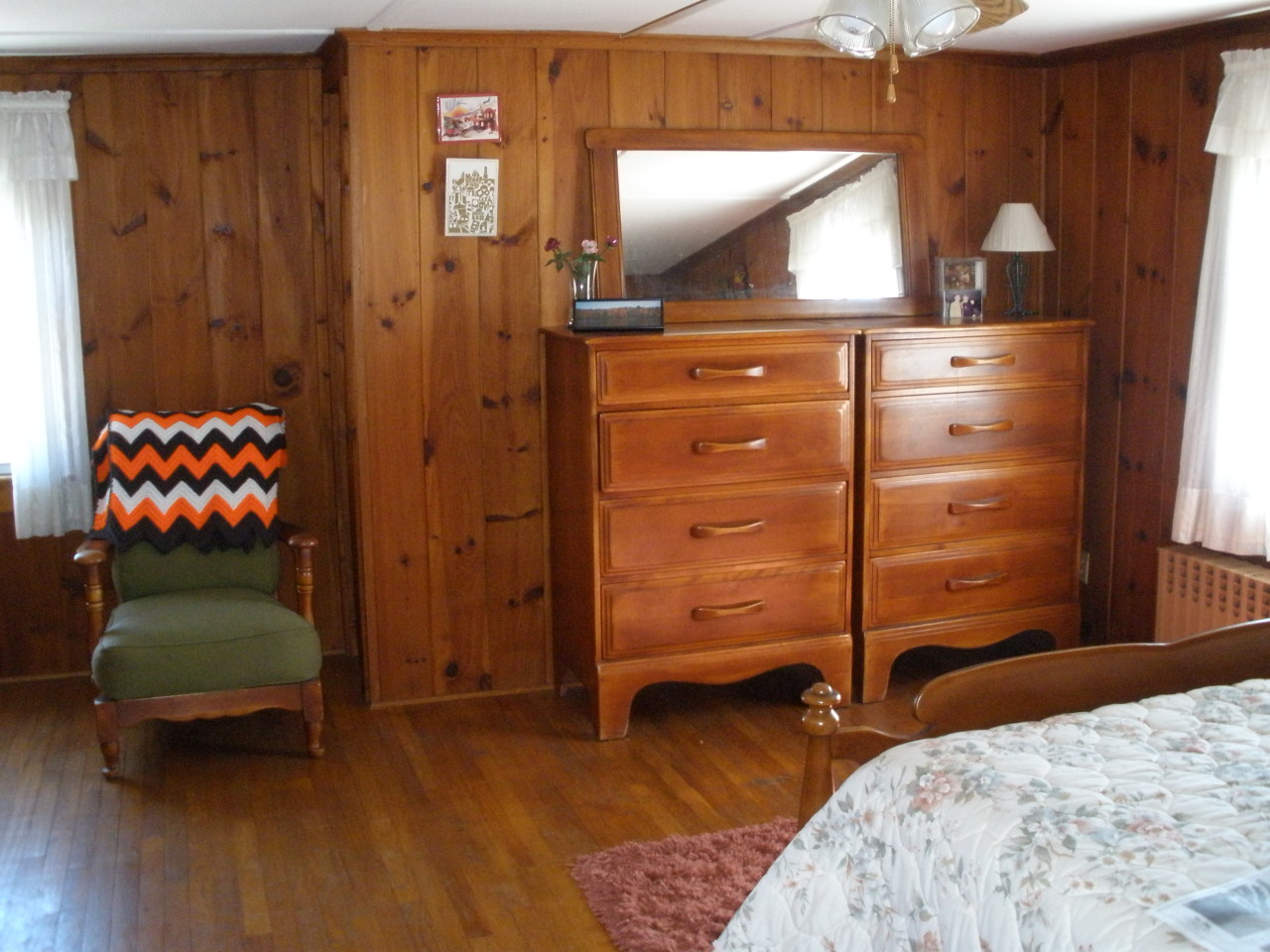 1603 North Main Road Otis, MA 01253 - Photo 17 of 17 a bedroom with a bed and a dresser