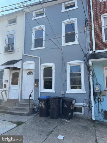 a view of a brick building with many windows
