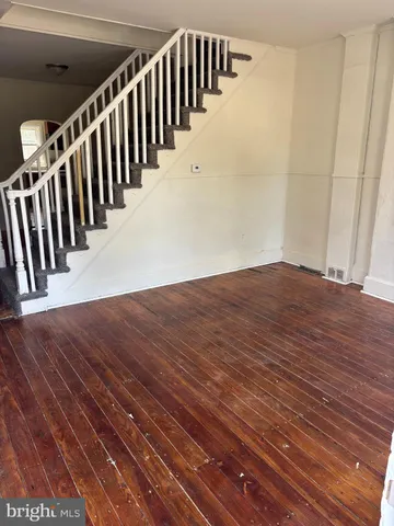 a view of staircase with wooden floor and stairs