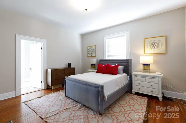 a bedroom with a bed and a desk