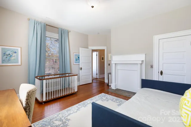 a bedroom with furniture and a window