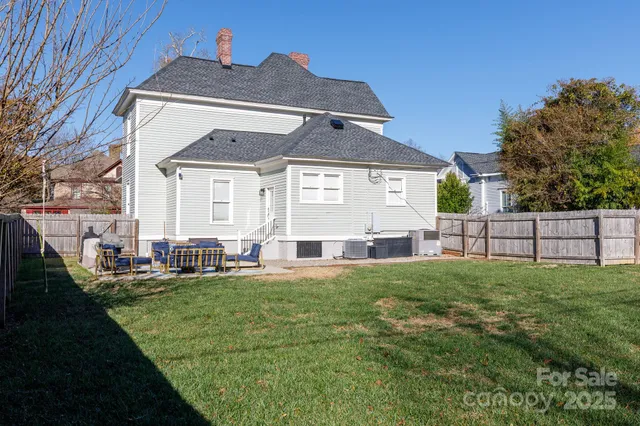 a front view of house with yard and outdoor seating