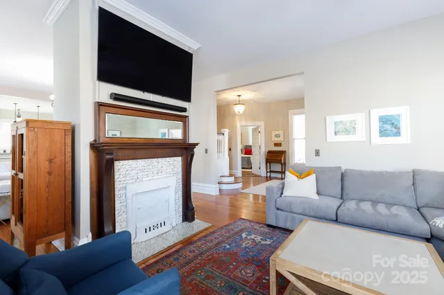 a living room with furniture and a flat screen tv