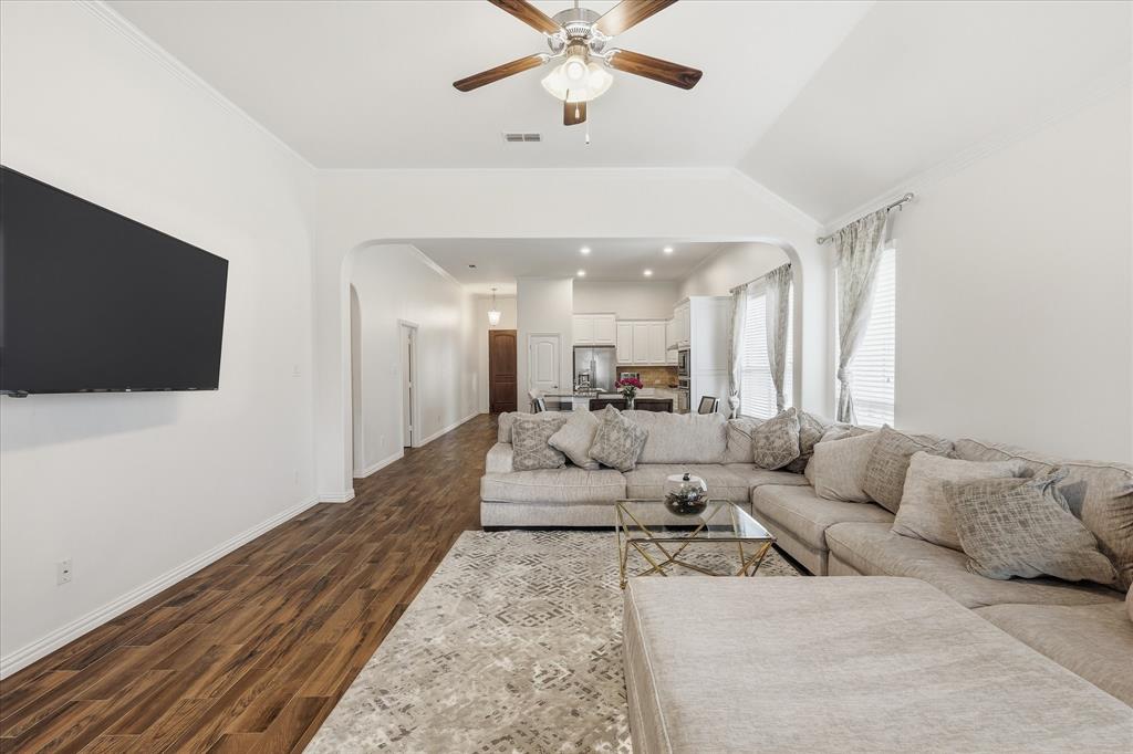 215 Equestrian Road Hickory Creek, TX 75065 - Photo 17 of 36 a living room with furniture and a flat screen tv