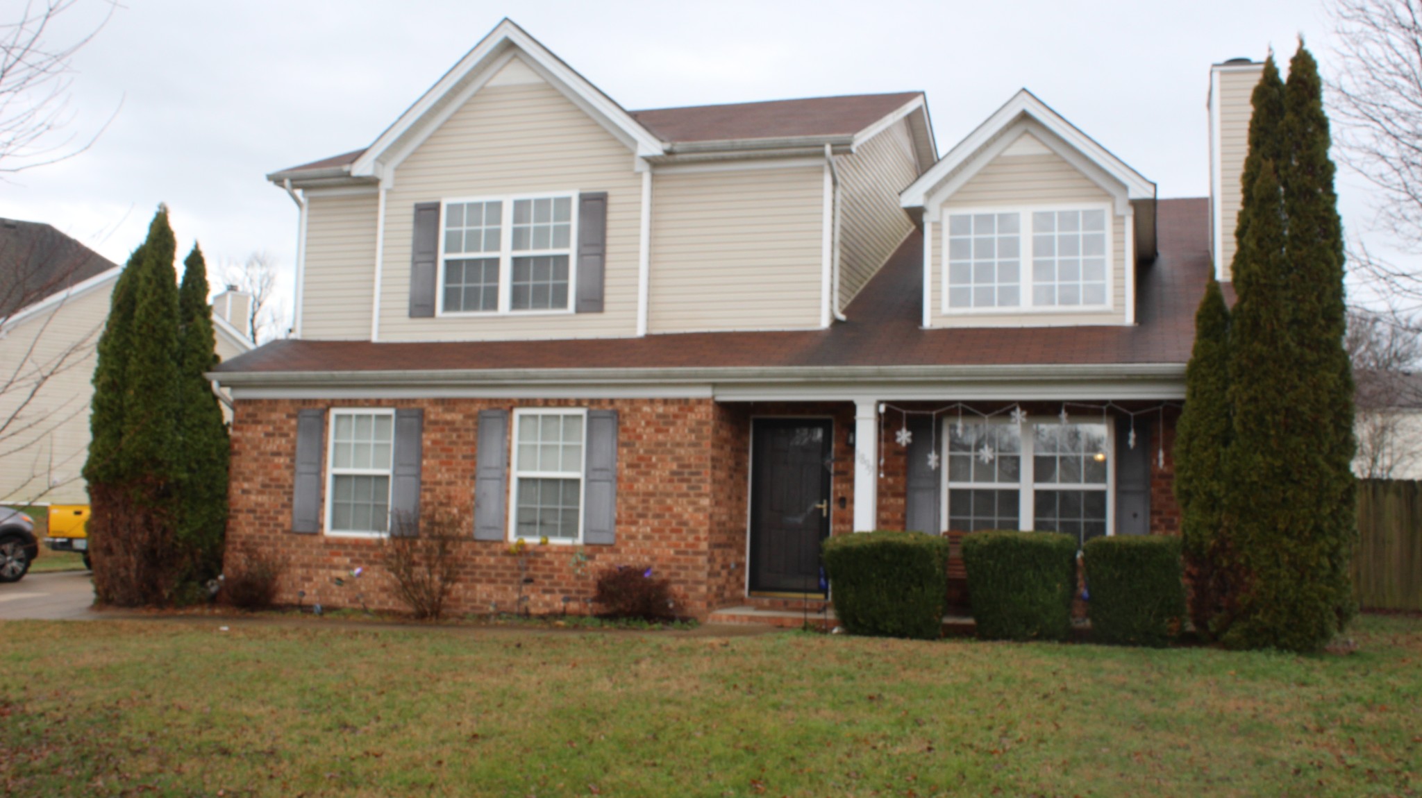 1899 Portway Road Spring Hill, TN 37174 - Photo 3 of 34 a front view of a house with a garden