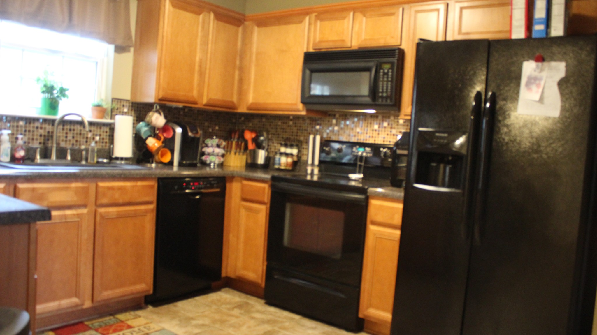 1899 Portway Road Spring Hill, TN 37174 - Photo 22 of 34 a kitchen with stainless steel appliances granite countertop a refrigerator and a stove