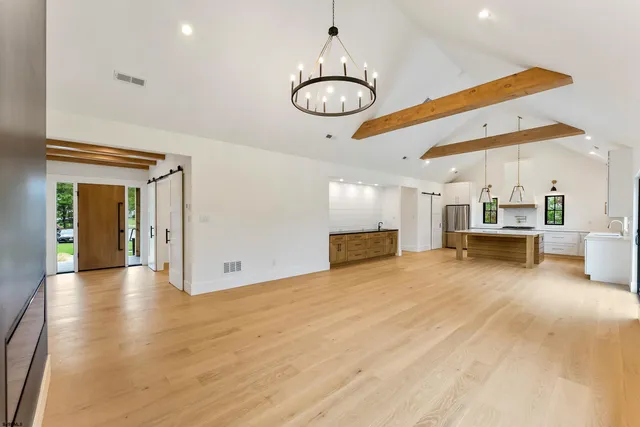 a view of kitchen with furniture and wooden floor