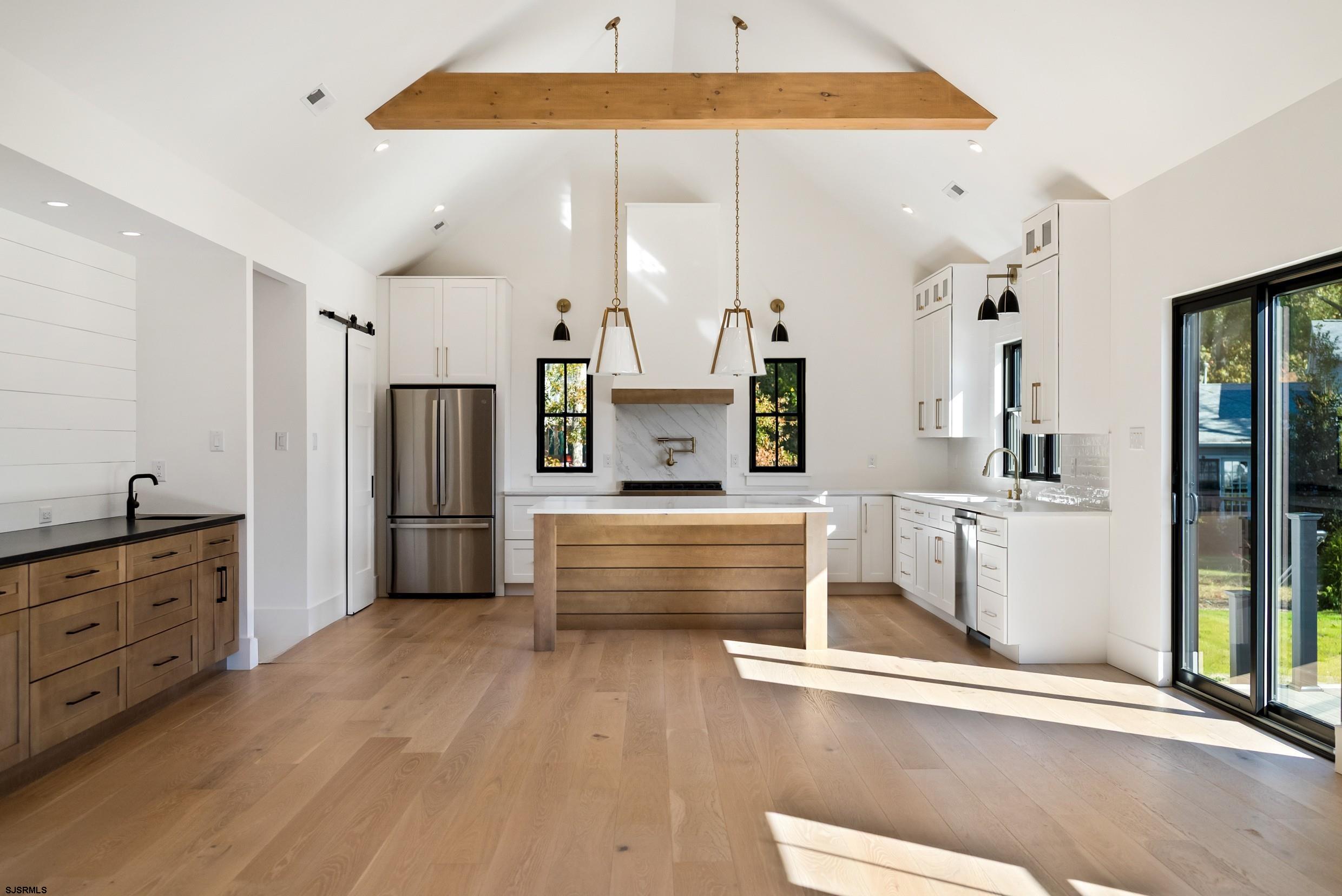 11 Evio John Court Marmora, NJ 08223 - Photo 13 of 49 a view of kitchen with furniture and wooden floor
