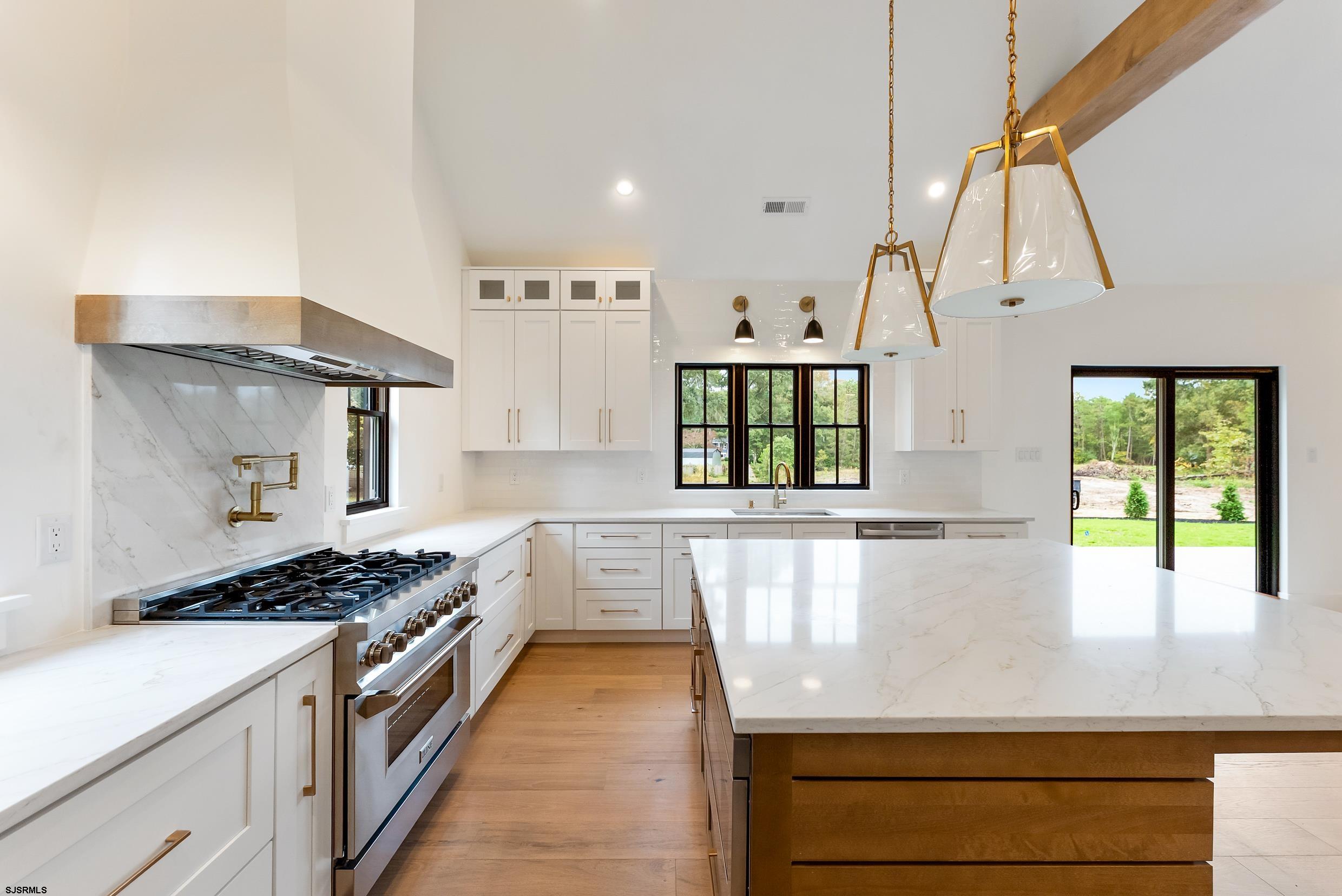11 Evio John Court Marmora, NJ 08223 - Photo 15 of 49 a kitchen with stainless steel appliances granite countertop a stove and a refrigerator