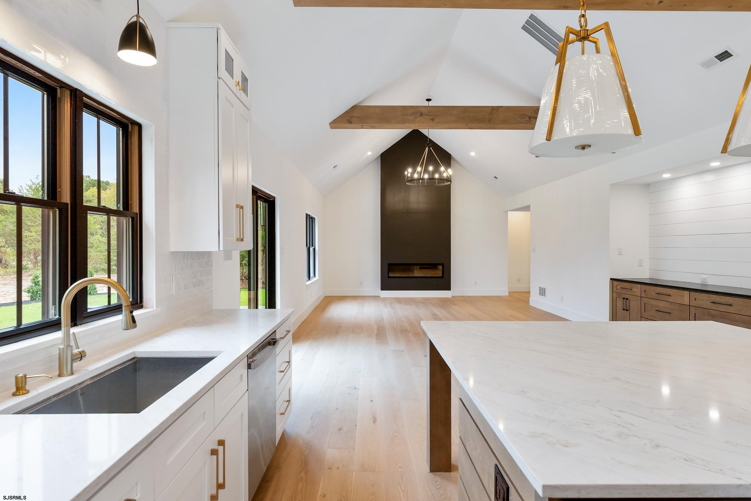 11 Evio John Court Marmora, NJ 08223 - Photo 21 of 49 a view of a kitchen with a sink and a large window