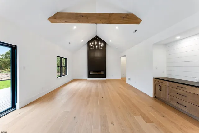 a kitchen with stainless steel appliances granite countertop a sink and a refrigerator
