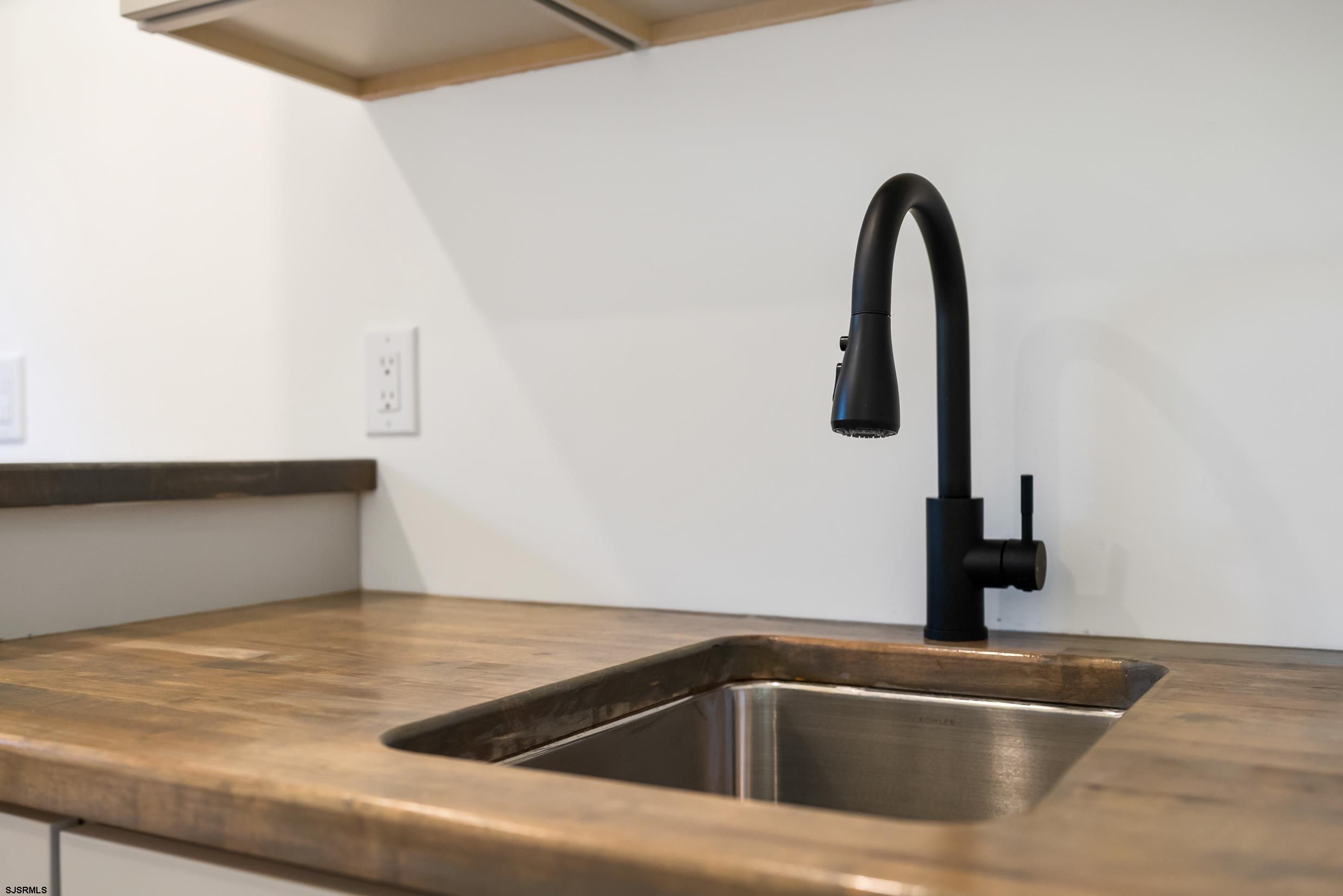 11 Evio John Court Marmora, NJ 08223 - Photo 24 of 49 a close view of sink and tap