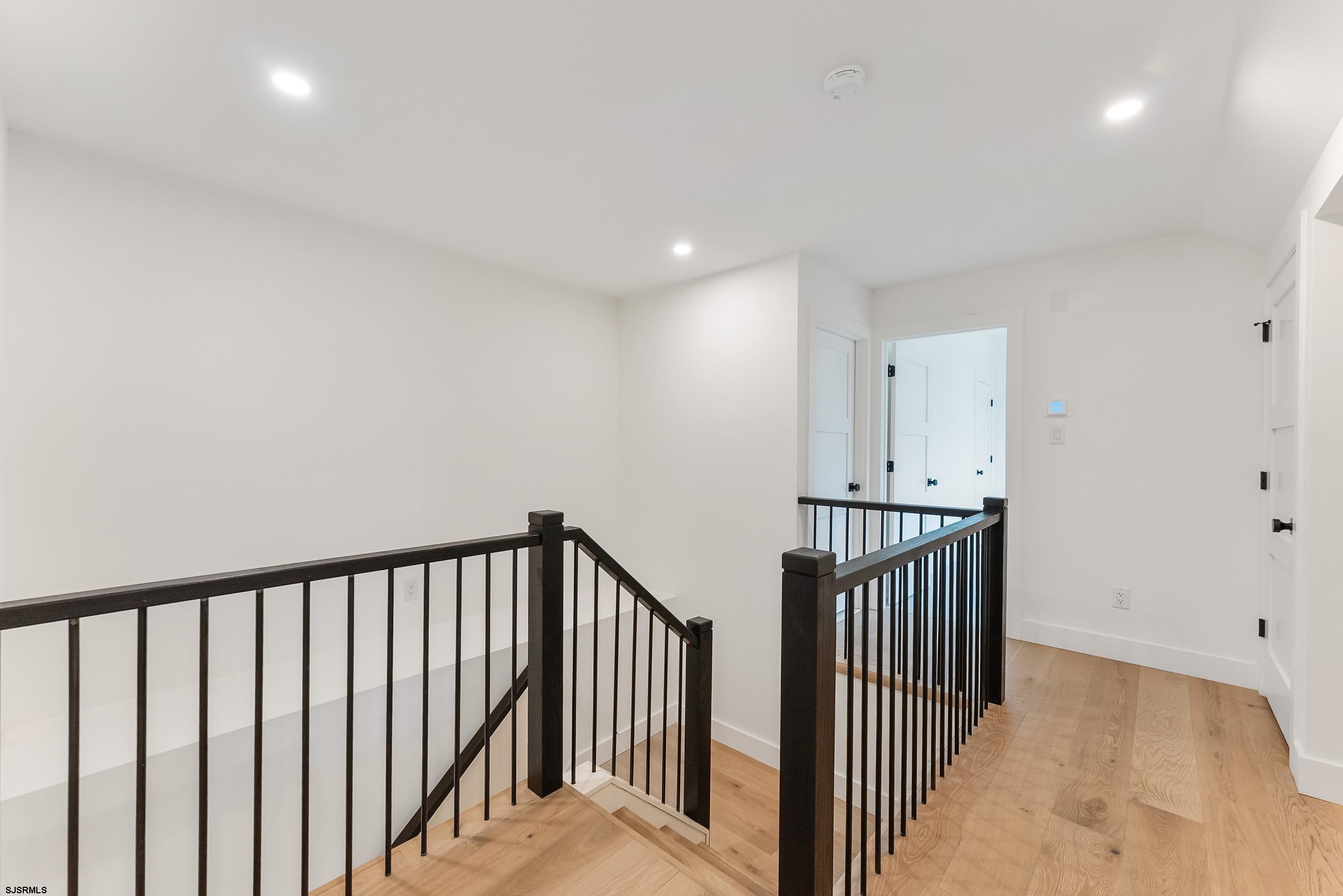 11 Evio John Court Marmora, NJ 08223 - Photo 38 of 49 a view of a hallway with wooden floor