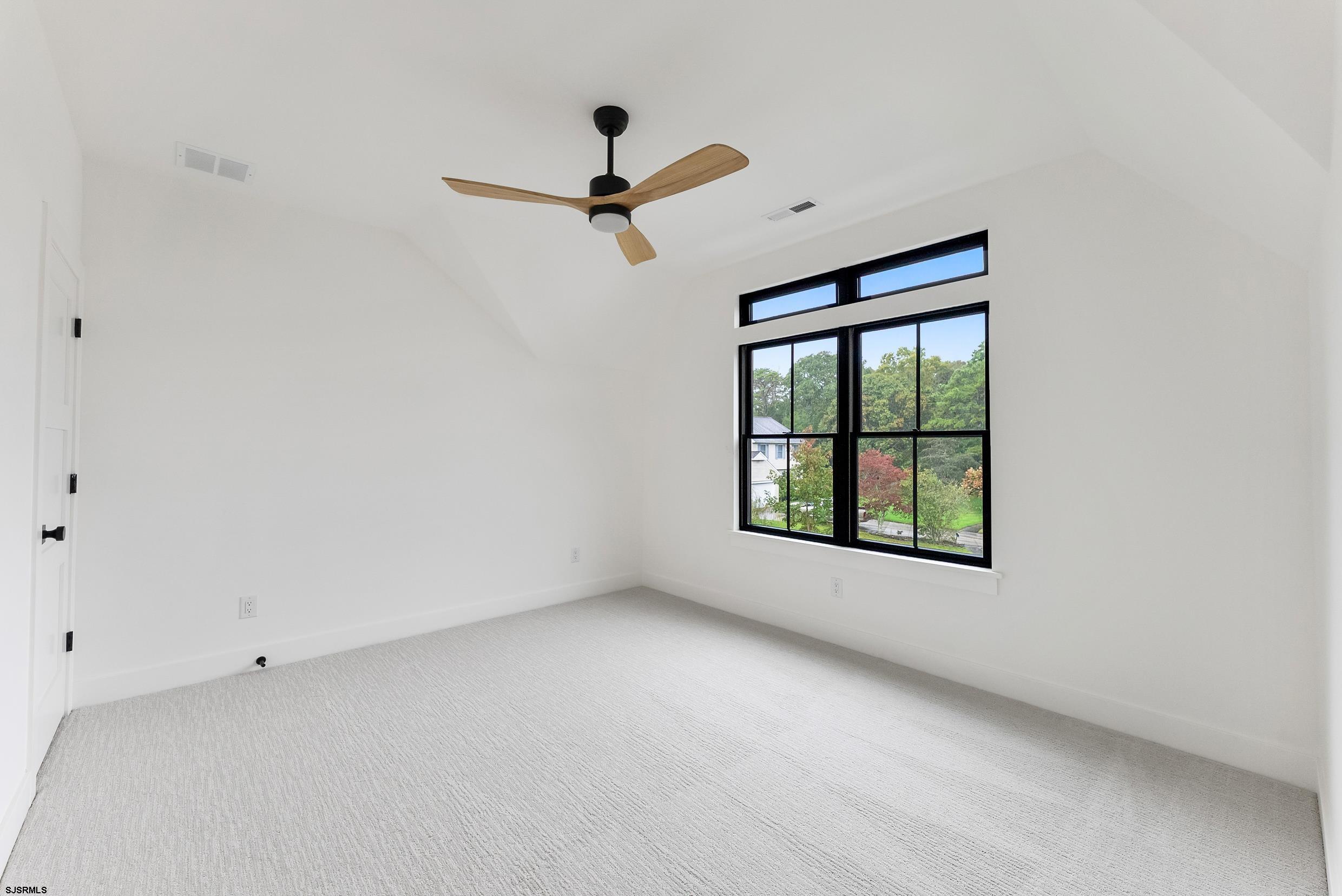 11 Evio John Court Marmora, NJ 08223 - Photo 39 of 49 a view of a room with a window and a ceiling fan