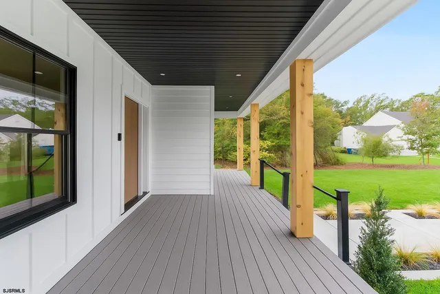 a view of front door with wooden floor