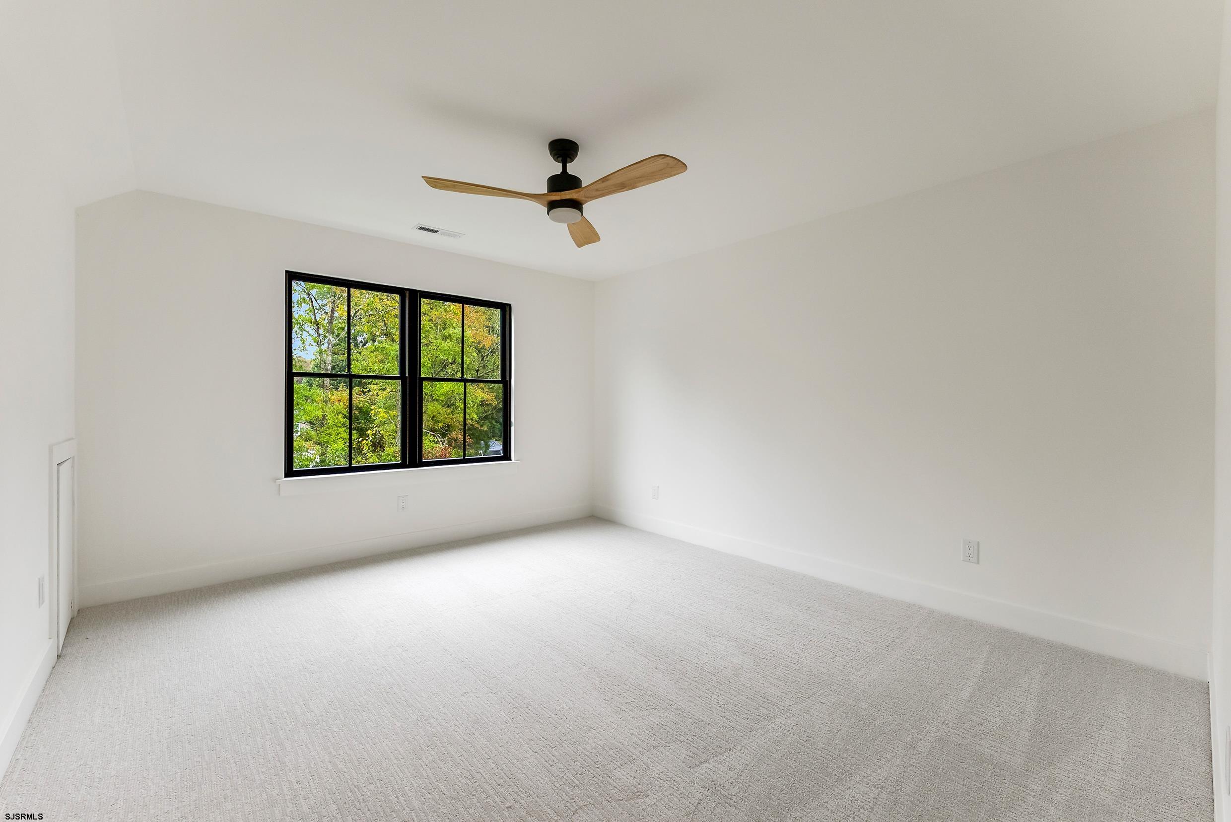 11 Evio John Court Marmora, NJ 08223 - Photo 41 of 49 an empty room with windows