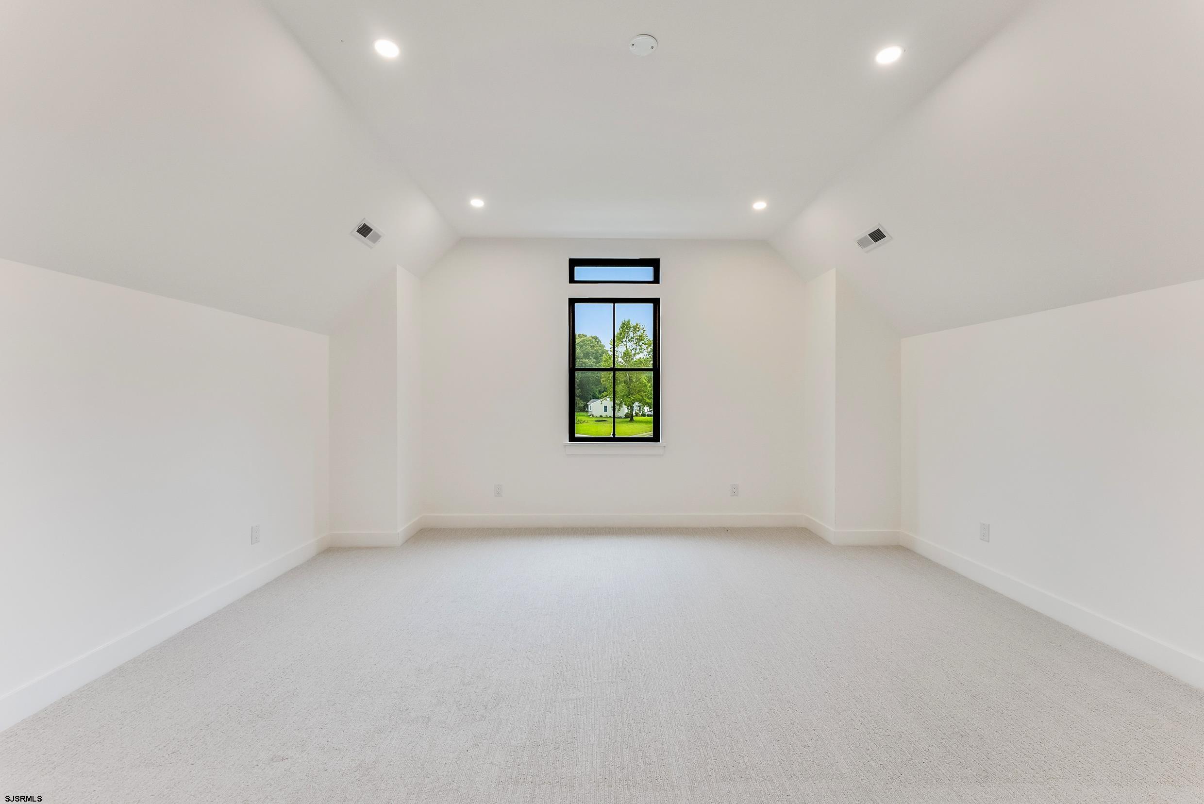 11 Evio John Court Marmora, NJ 08223 - Photo 43 of 49 an empty room with window and the ceiling fan