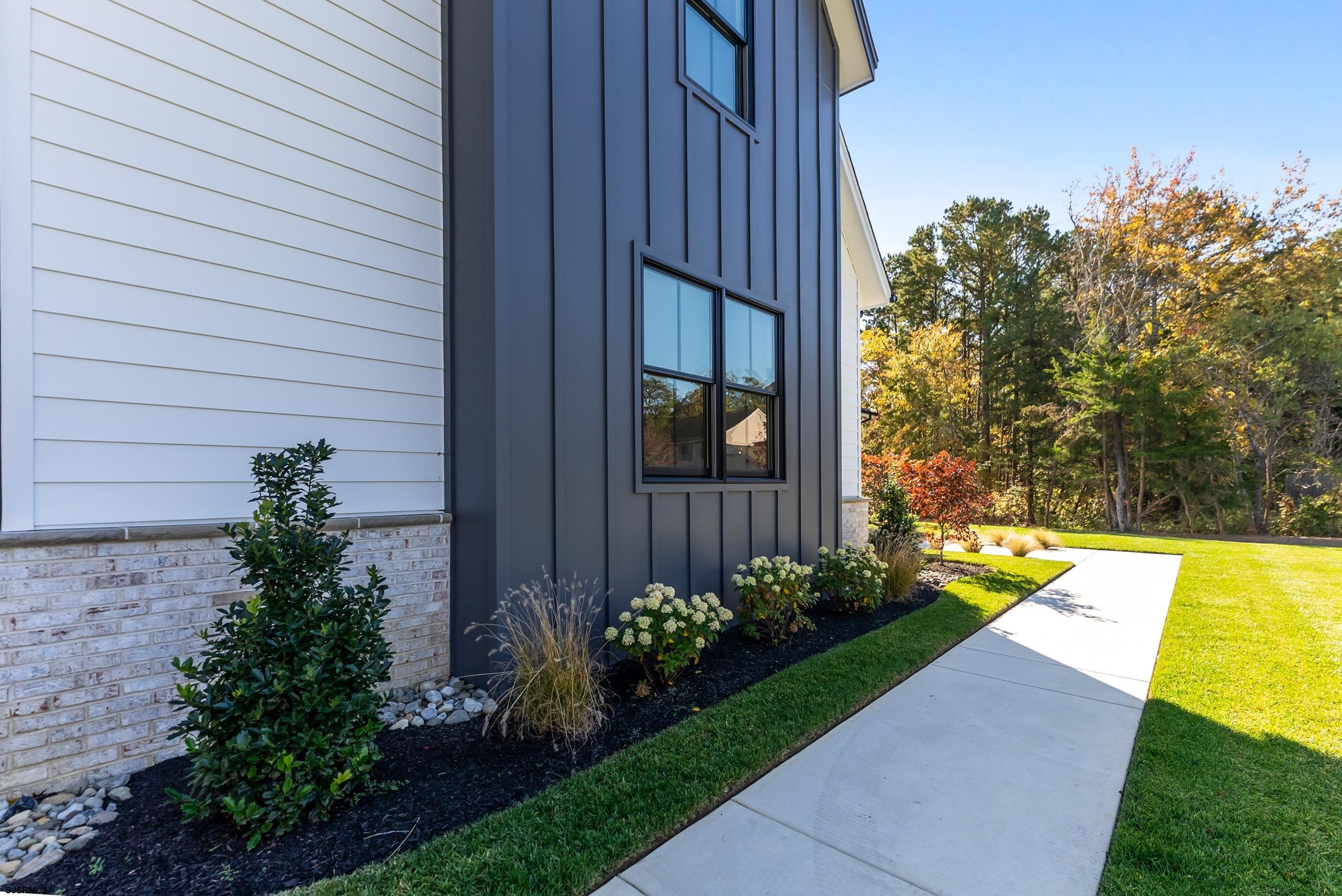 11 Evio John Court Marmora, NJ 08223 - Photo 48 of 49 a view of a house with a backyard