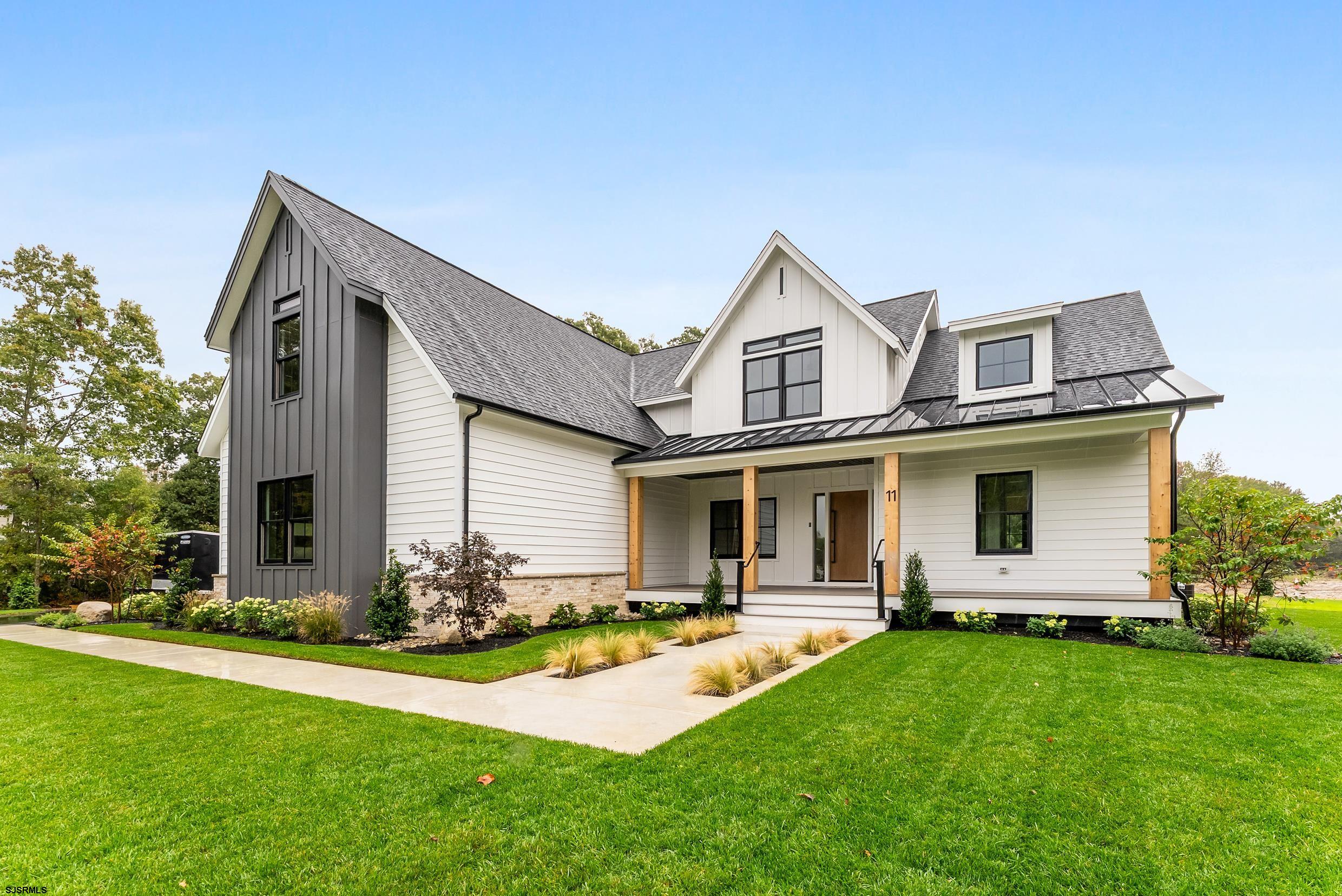 11 Evio John Court Marmora, NJ 08223 - Photo 49 of 49 a front view of house with yard and green space