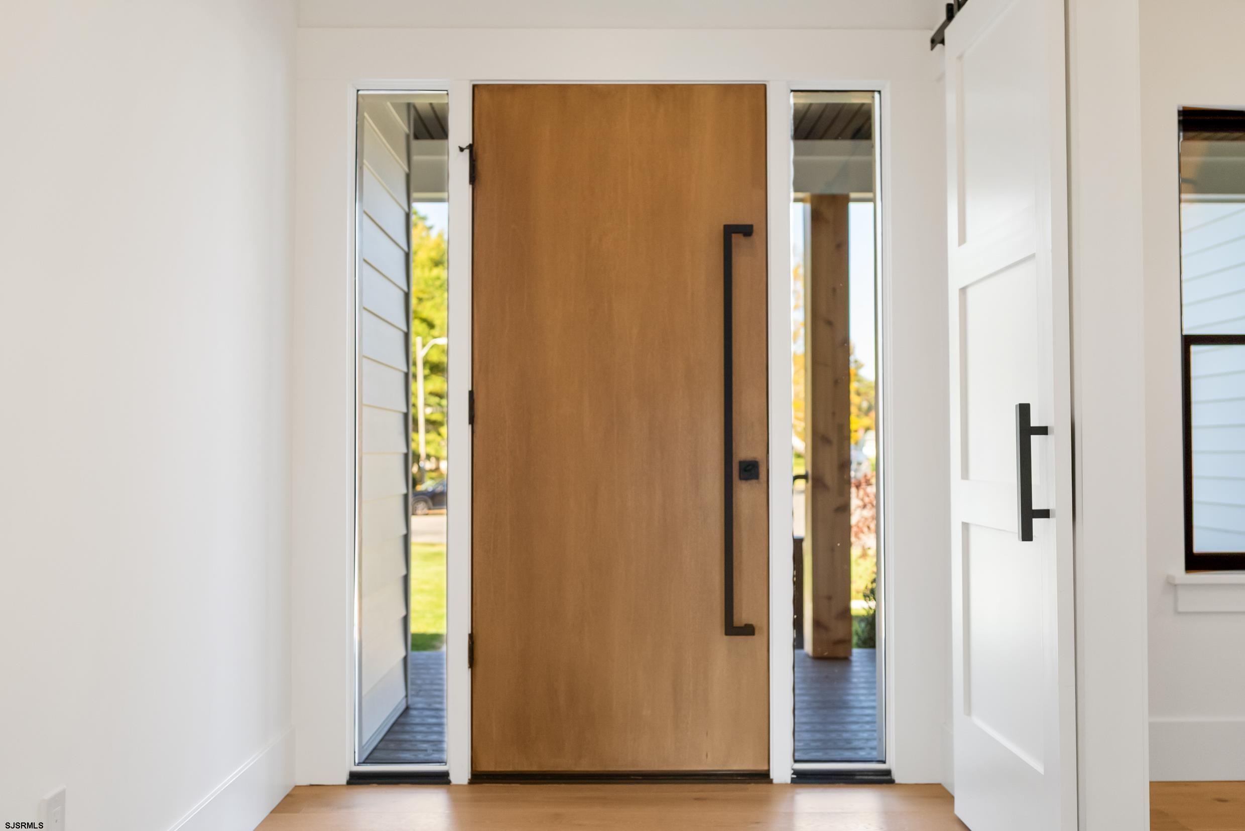 11 Evio John Court Marmora, NJ 08223 - Photo 5 of 49 a view of front door with wooden floor