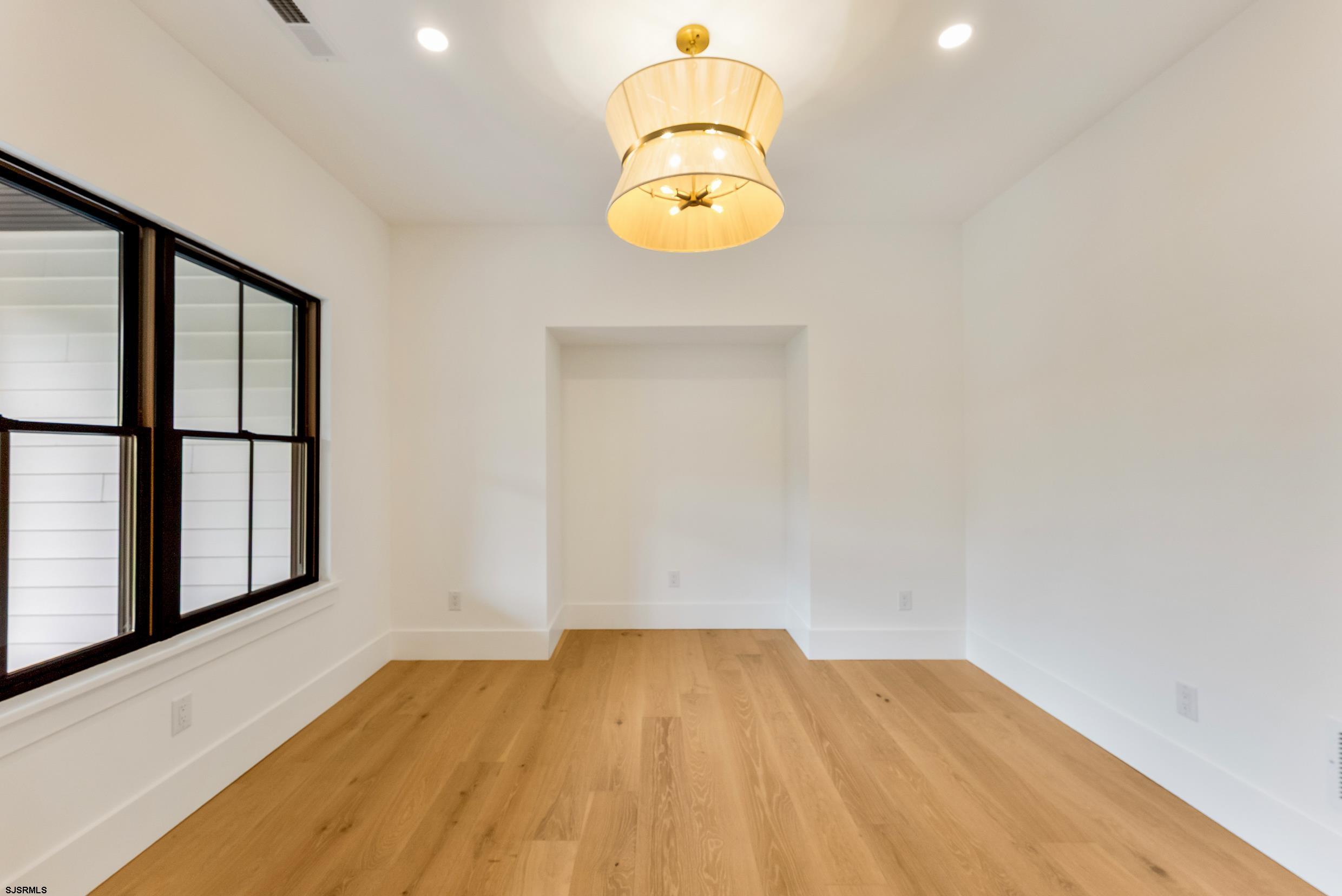 11 Evio John Court Marmora, NJ 08223 - Photo 8 of 49 a view of a room with wooden floor and window