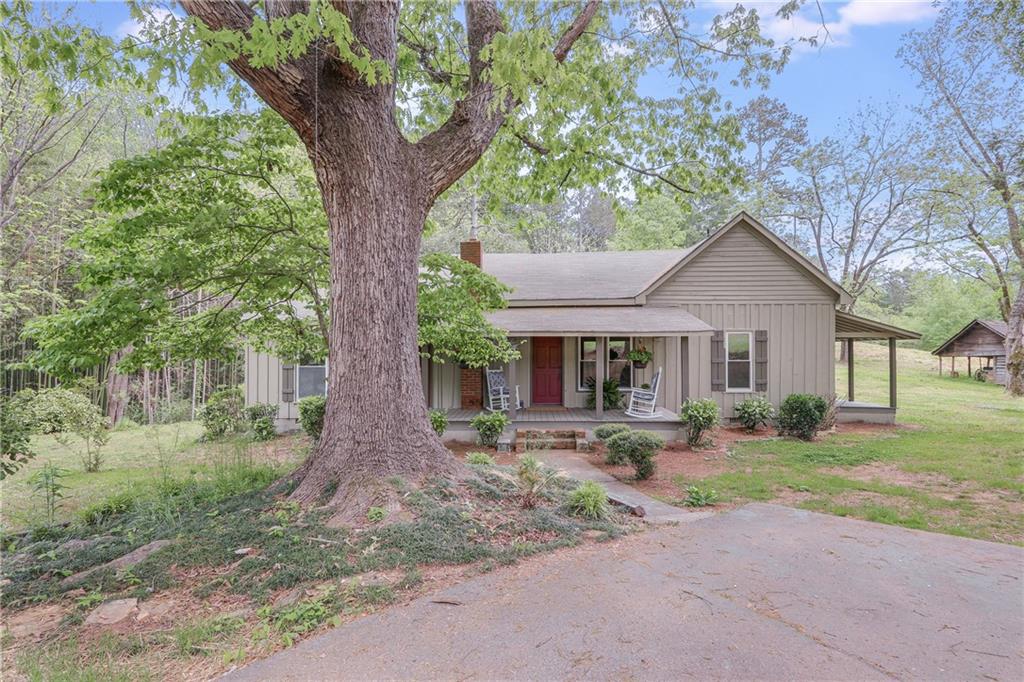 6037 Julian Baugh Road Lula, GA 30554 - Photo 1 of 1 a front view of house with yard and green space