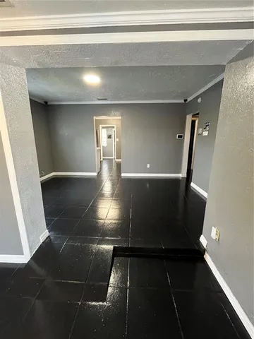 a bathroom with a sink a large mirror and bathtub