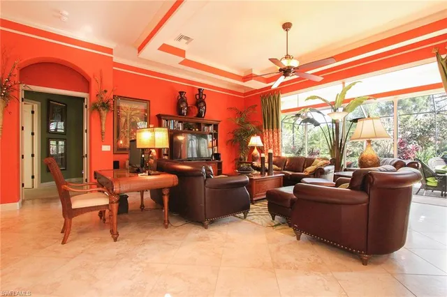 a living room with furniture a window and a fireplace