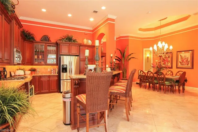 a dinning table and chairs in the patio of a city