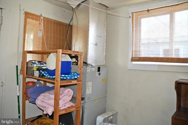 a bathroom with a sink mirror and toilet