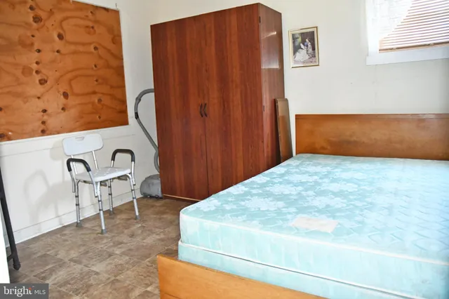 a bedroom with a bed and furniture