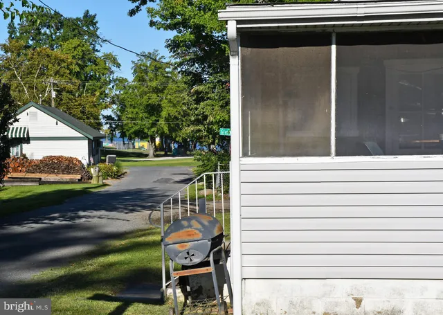 a backyard of a house with outdoor seating