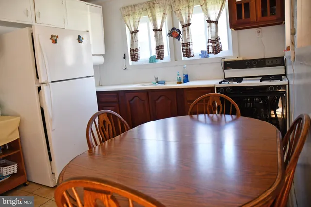 a view of kitchen and dining room with wooden floor