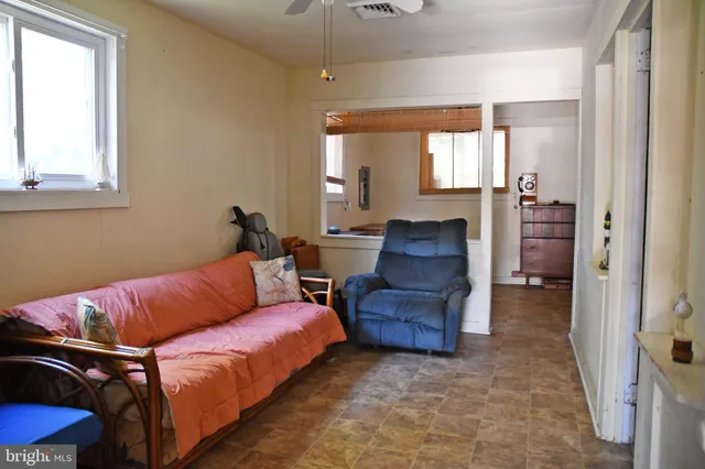 a living room with furniture and a window