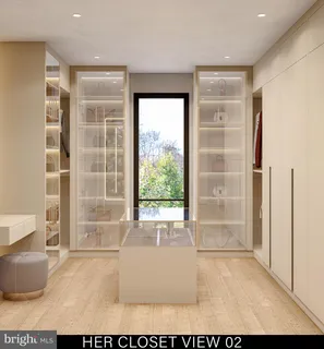 a living room with furniture and a painting on the wall