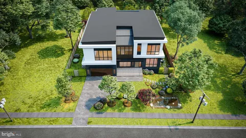 a aerial view of a house with a yard