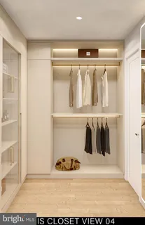 a bathroom with a sink mirror and toilet
