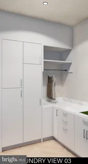 a view of a bedroom with wooden floor and windows