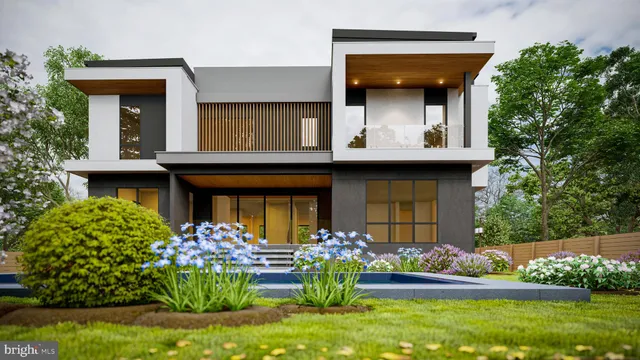 a front view of a house with a yard and potted plants