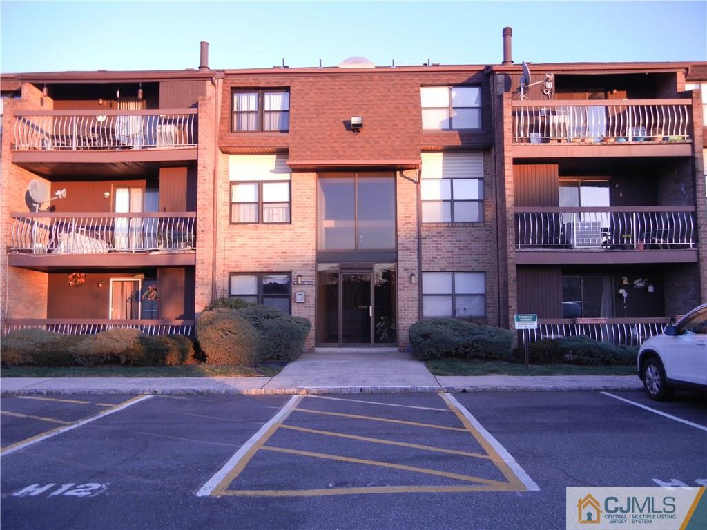 1643 Raspberry Court Edison, NJ 08817 - Photo 1 of 11 a front view of a building with a garden