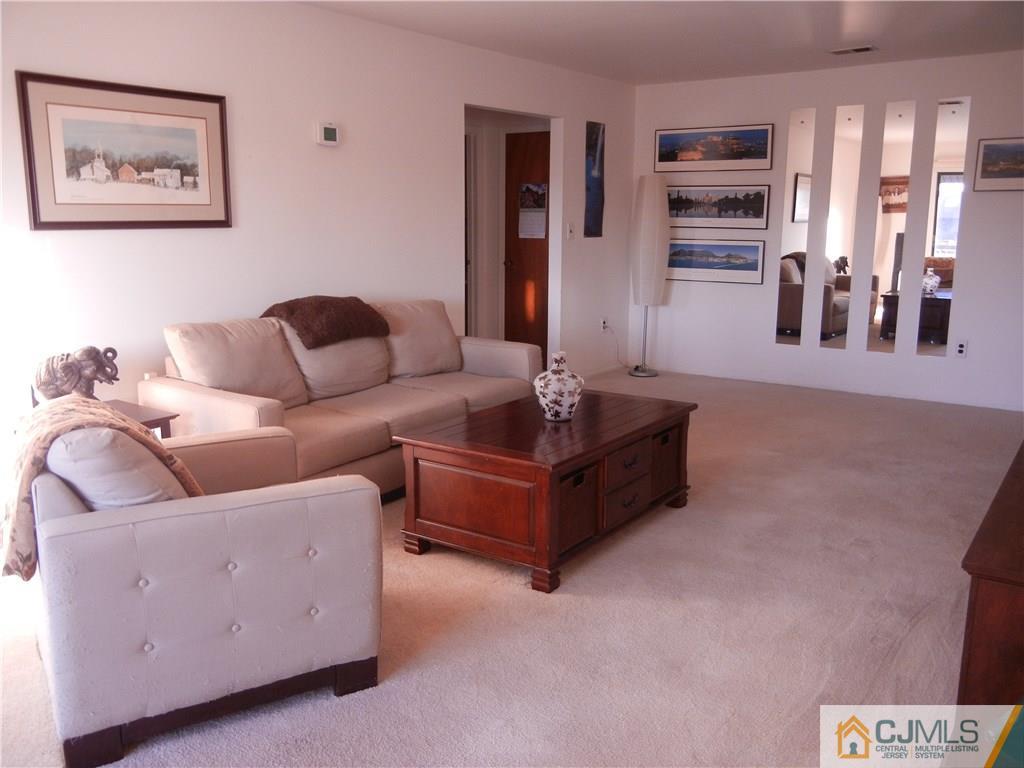 1643 Raspberry Court Edison, NJ 08817 - Photo 2 of 11 a living room with furniture and wooden floor