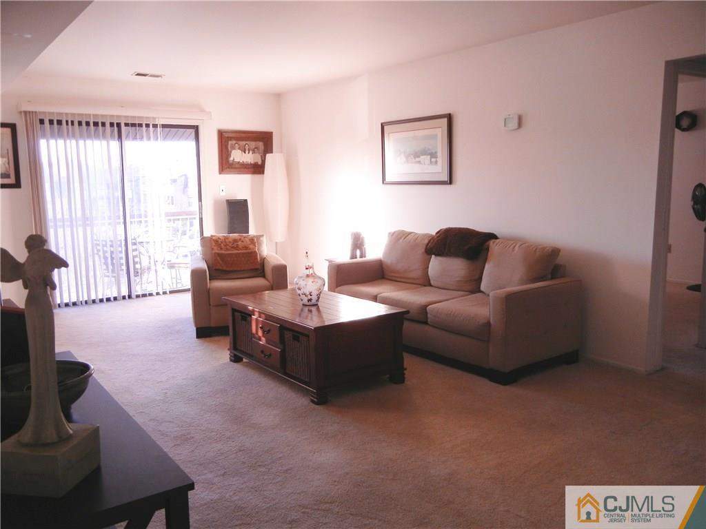 1643 Raspberry Court Edison, NJ 08817 - Photo 3 of 11 a living room with furniture and a flat screen tv
