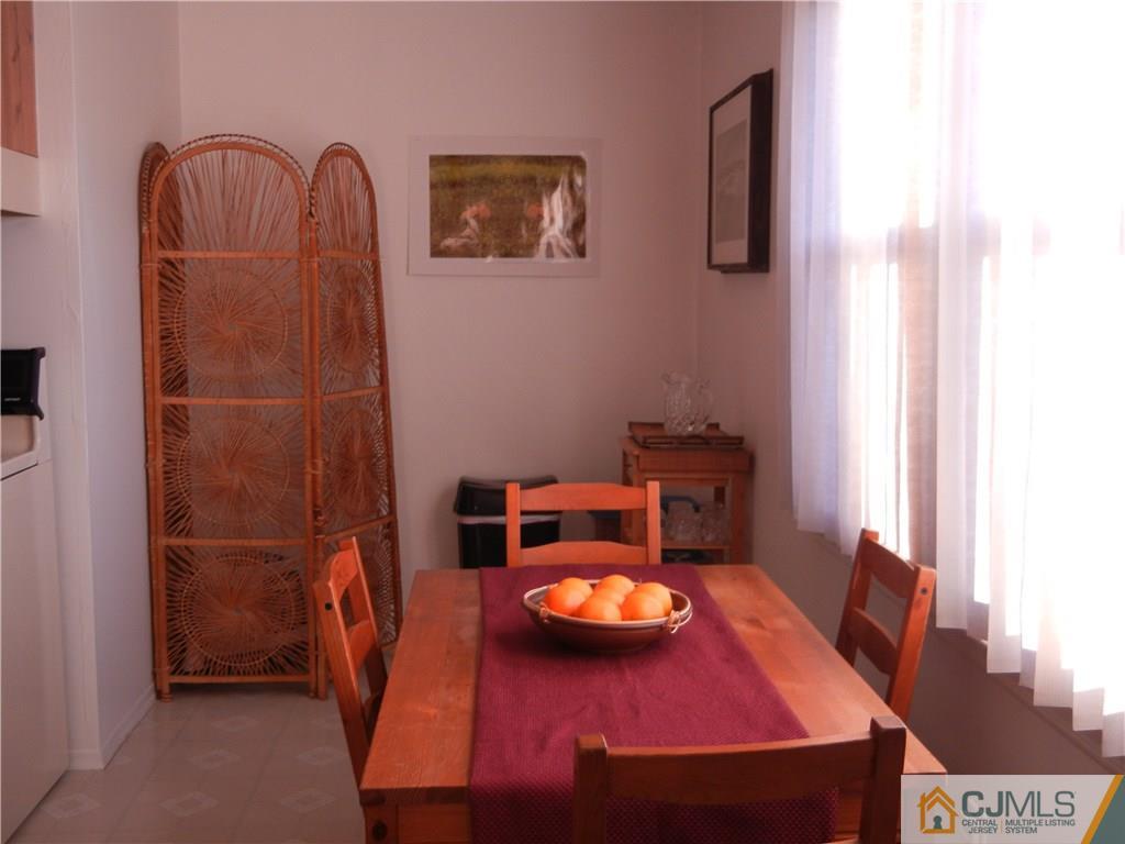 1643 Raspberry Court Edison, NJ 08817 - Photo 5 of 11 a dining room with furniture and wooden floor