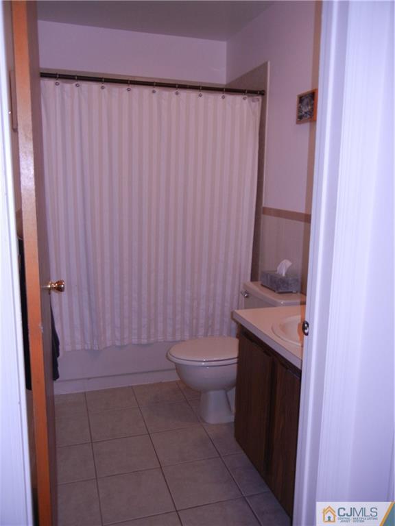 1643 Raspberry Court Edison, NJ 08817 - Photo 7 of 11 a bathroom with a granite countertop toilet and a sink